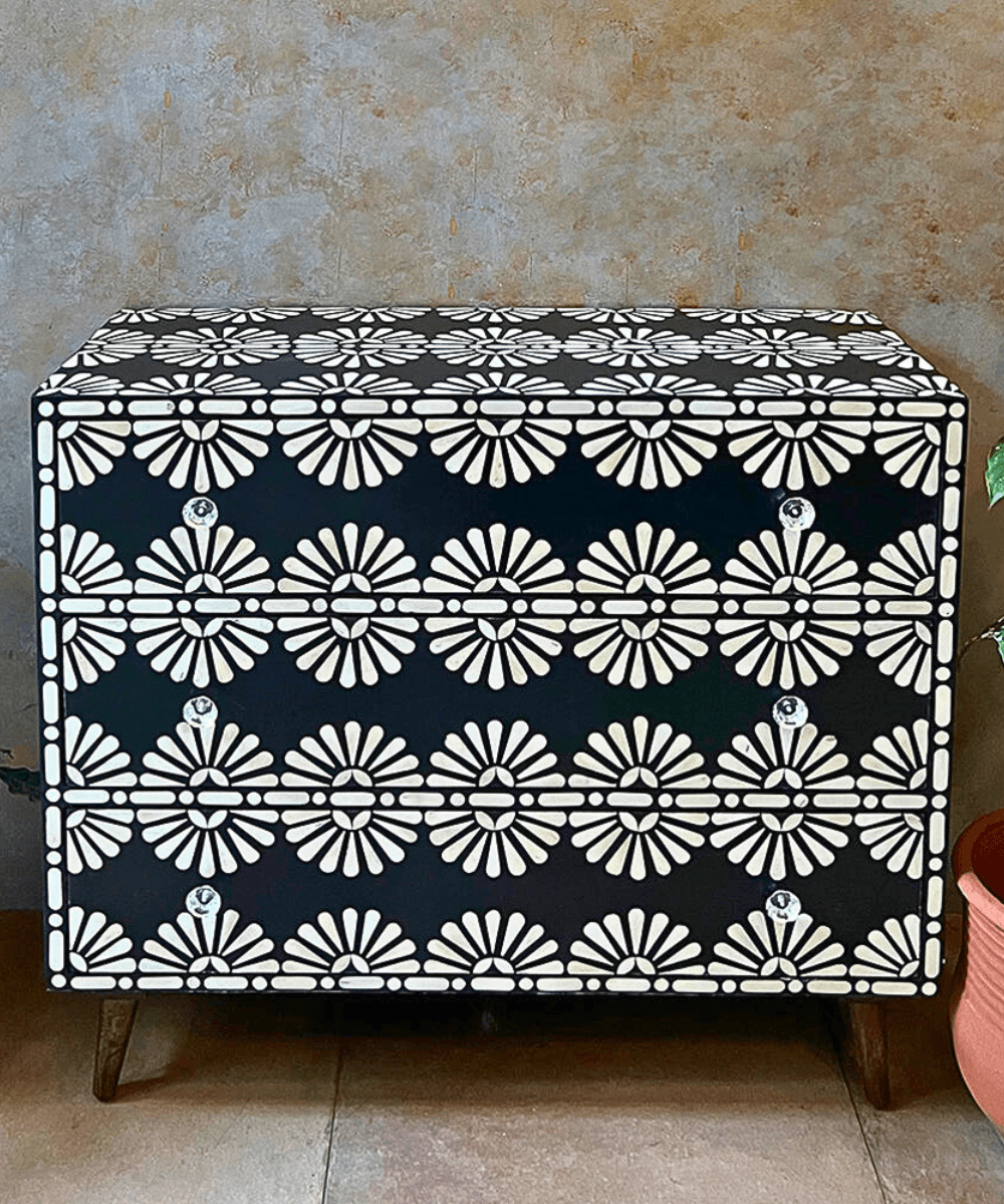 Close-up of intricate bone-inlay pattern
Decorated top view with accessories
Open drawer revealing interior space