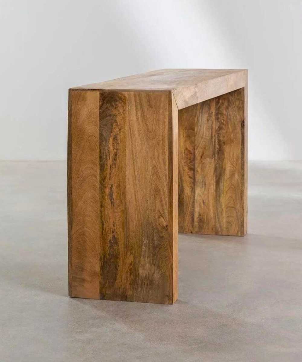 Close-up of the elegant wood grain and curved edges
