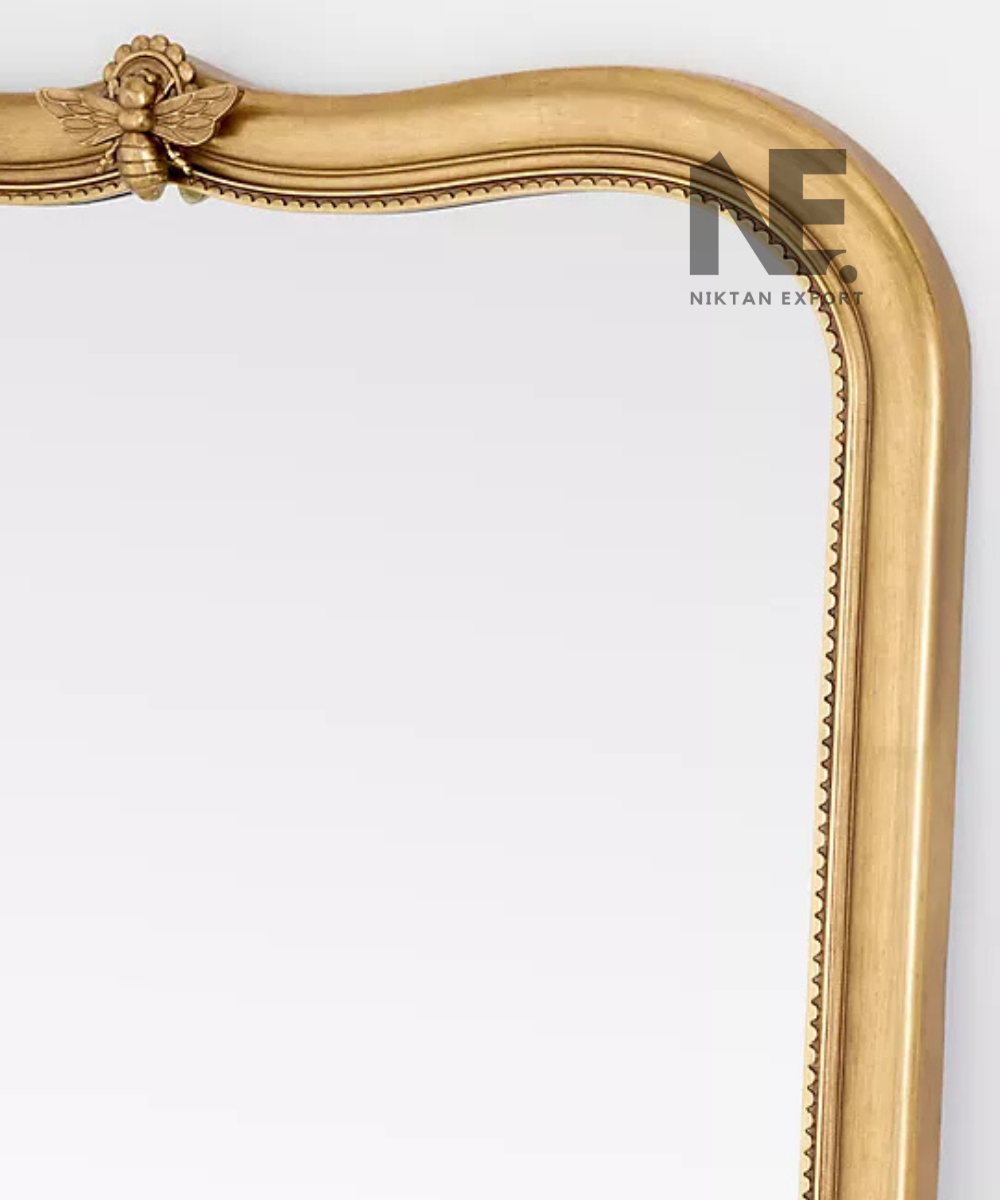 Full-length arched mirror with an antique gold finish