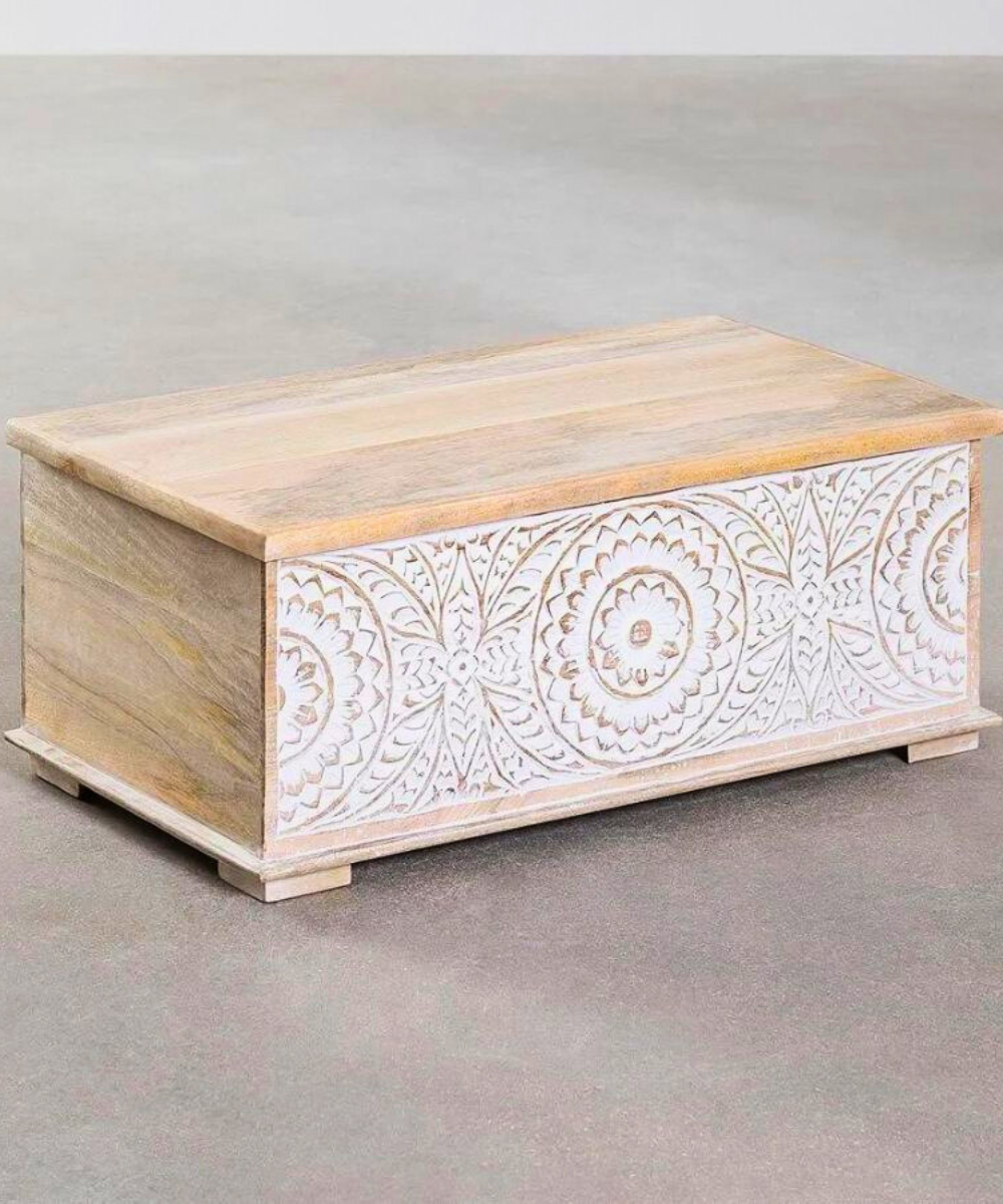 Close-up of hand-carved floral detailing on the trunk