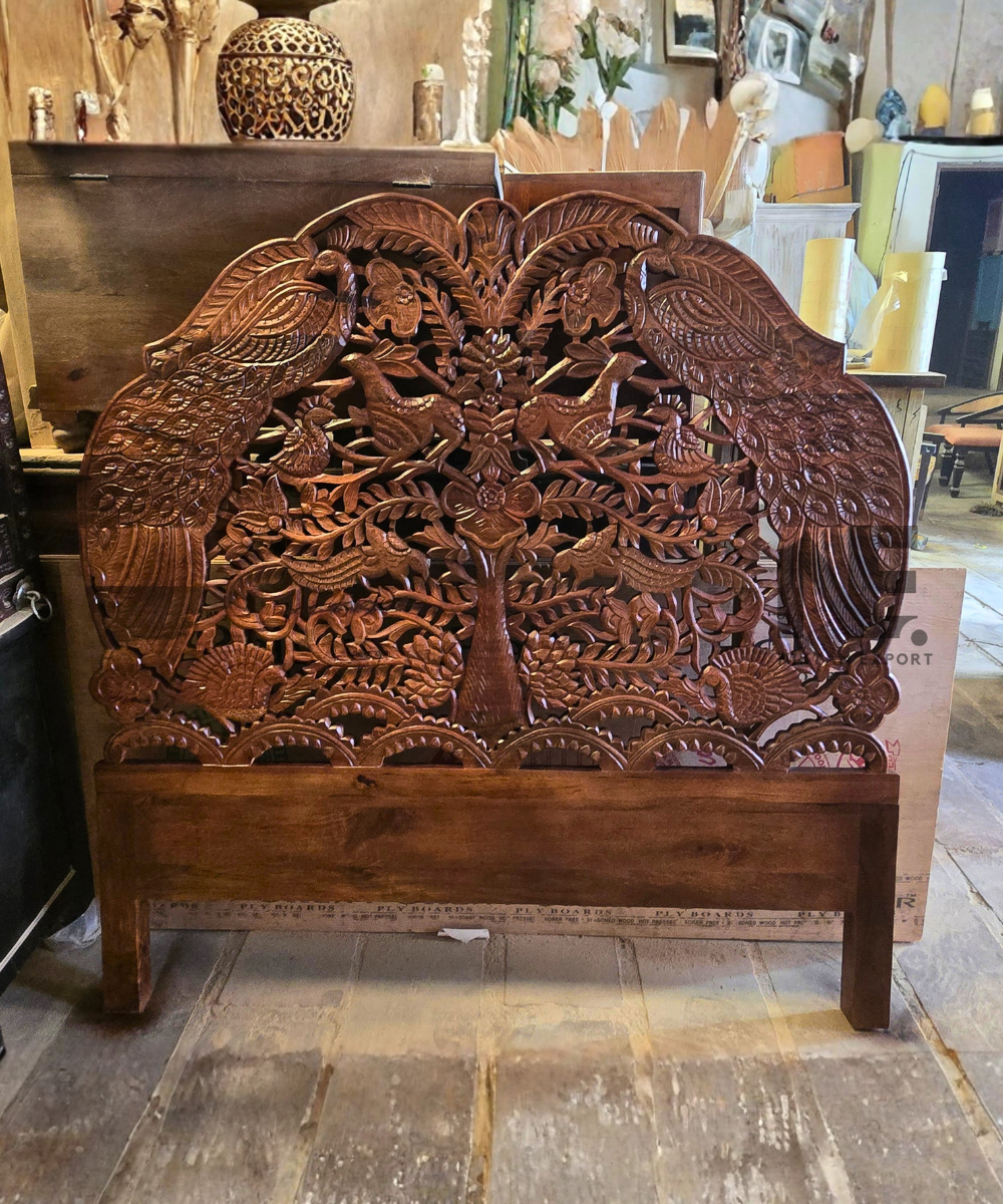 Nature-inspired foliage carving on a wooden headboard