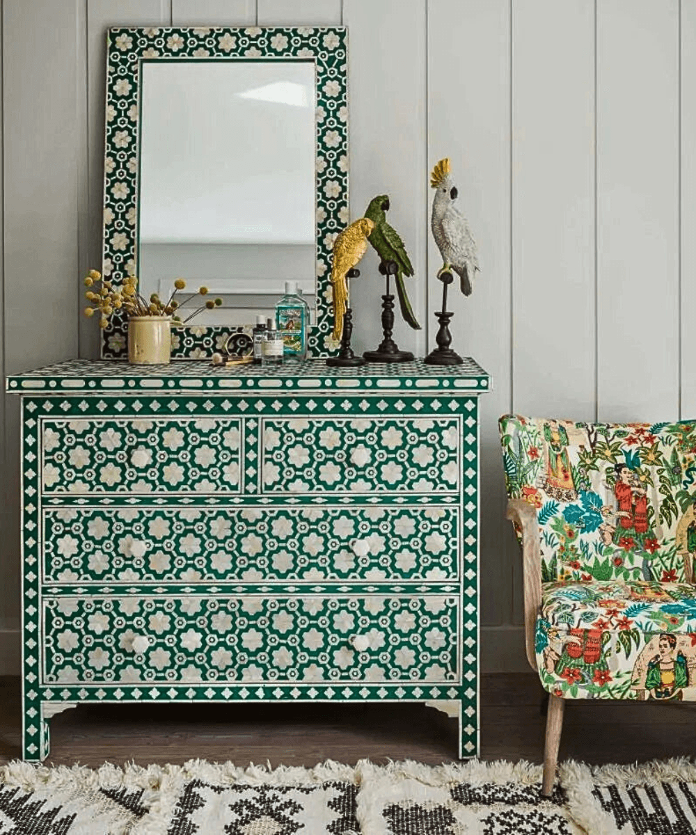 Close-up of floral inlay pattern and bone detailing