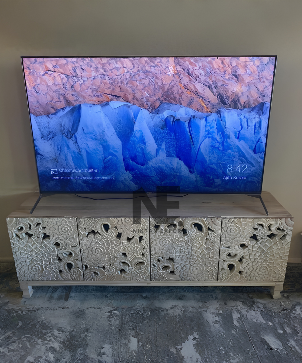 Front view of an ivory carved wooden sideboard