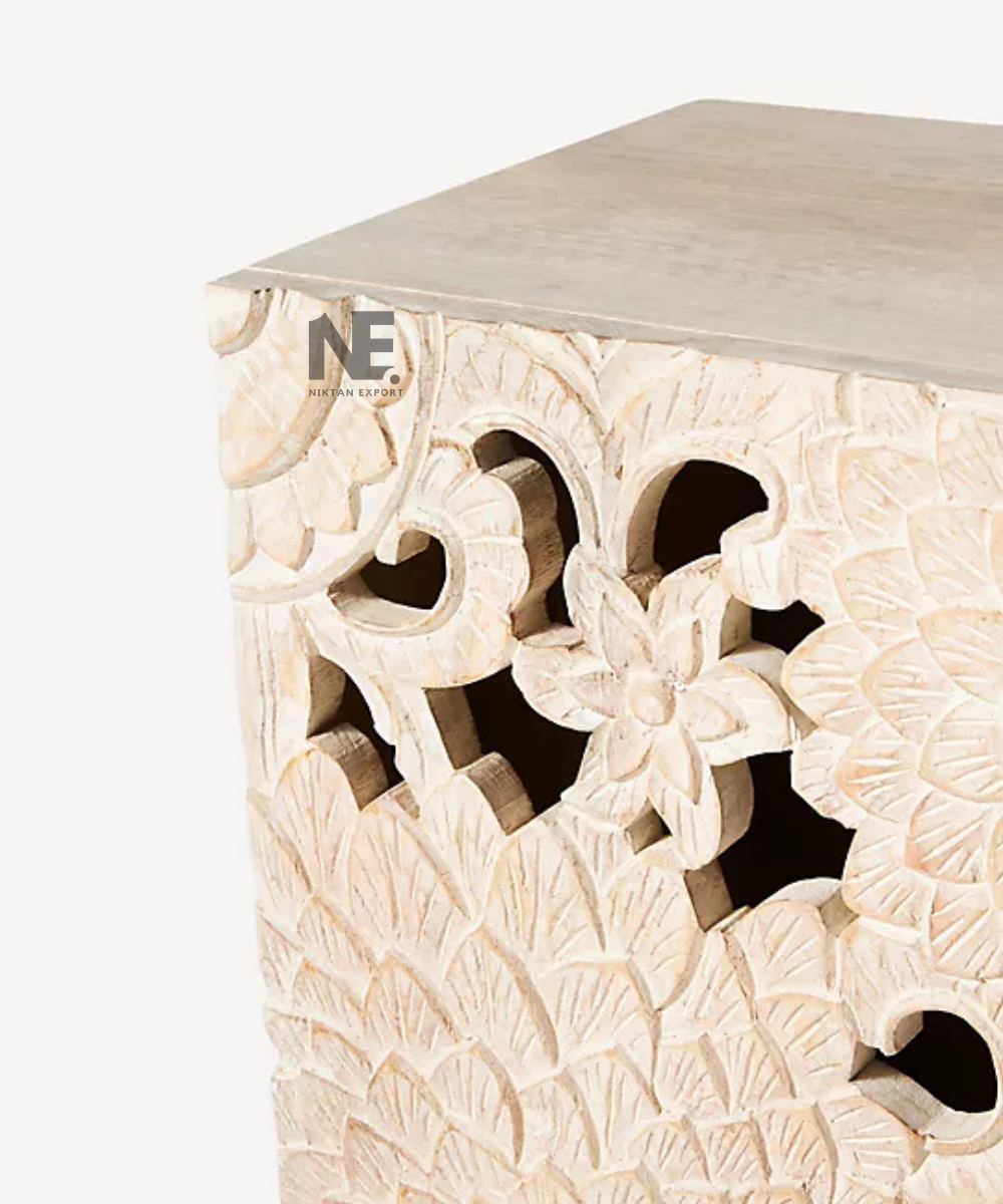 Intricate floral cutout detailing on natural wood cabinet