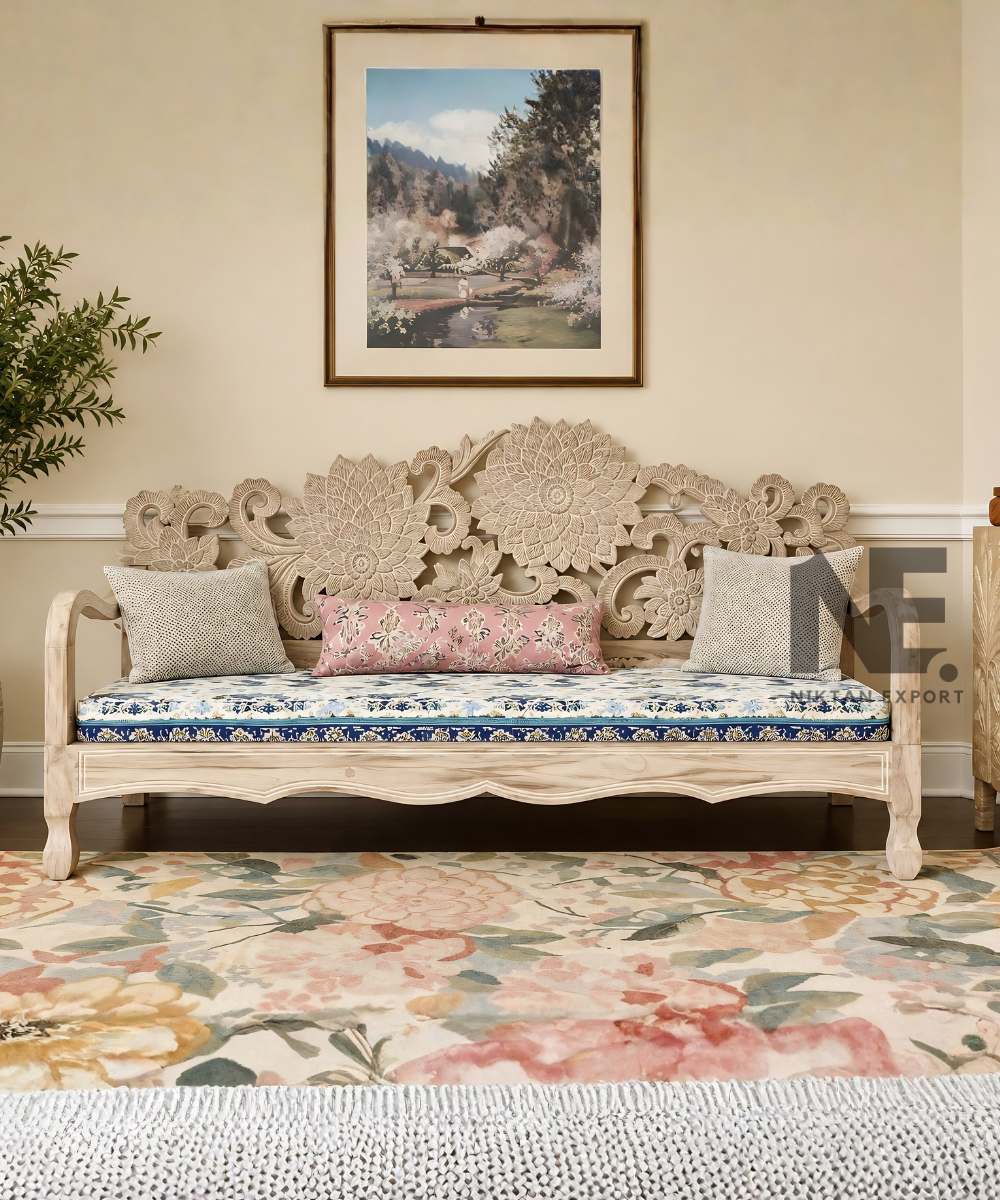 Hand-carved wooden daybed with ornate floral backrest