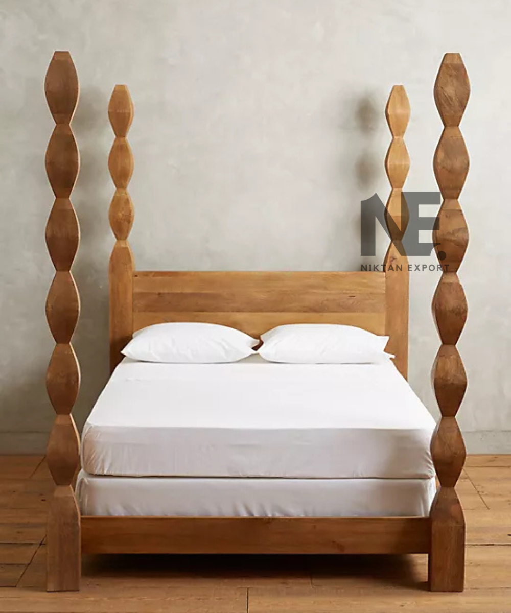 Natural wood four poster bed with tall decorative posts