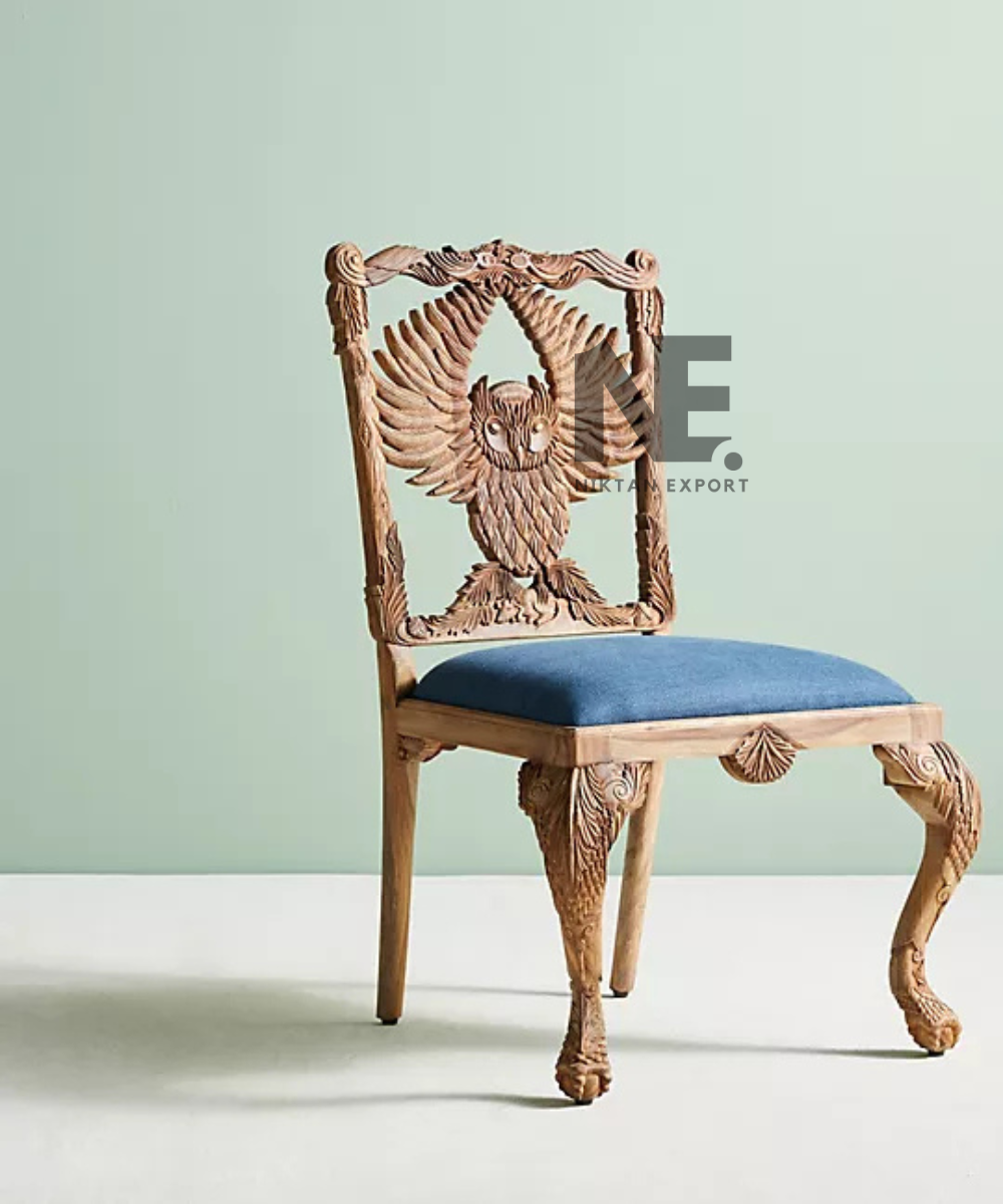 Front view of carved wooden owl dining chair