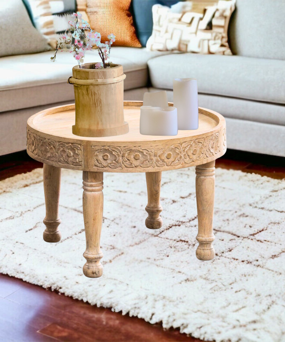 Handcrafted carved round coffee table front view