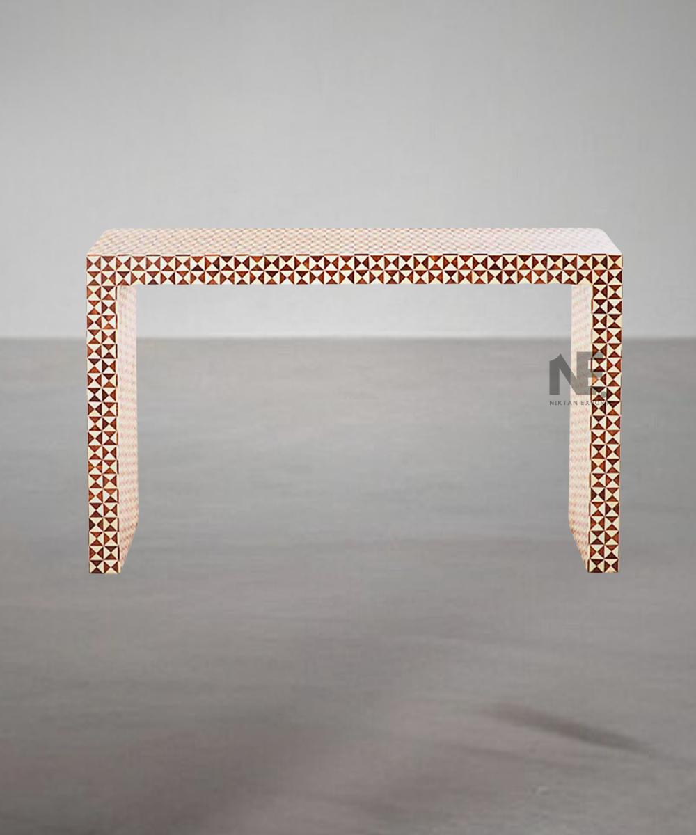 Close-up of white bone inlay pattern on brown surface