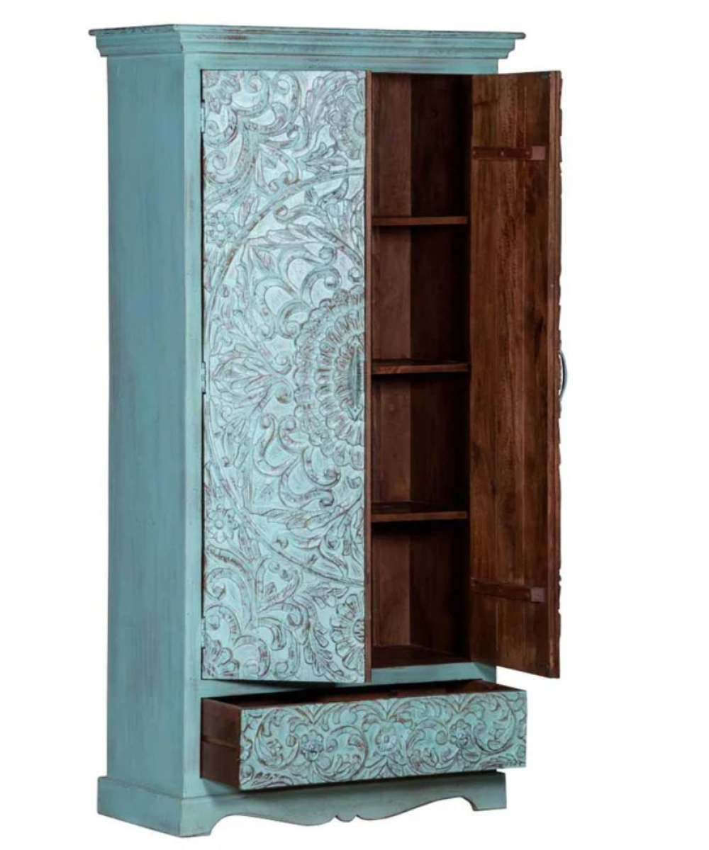 Front view of carved armoire with doors closed