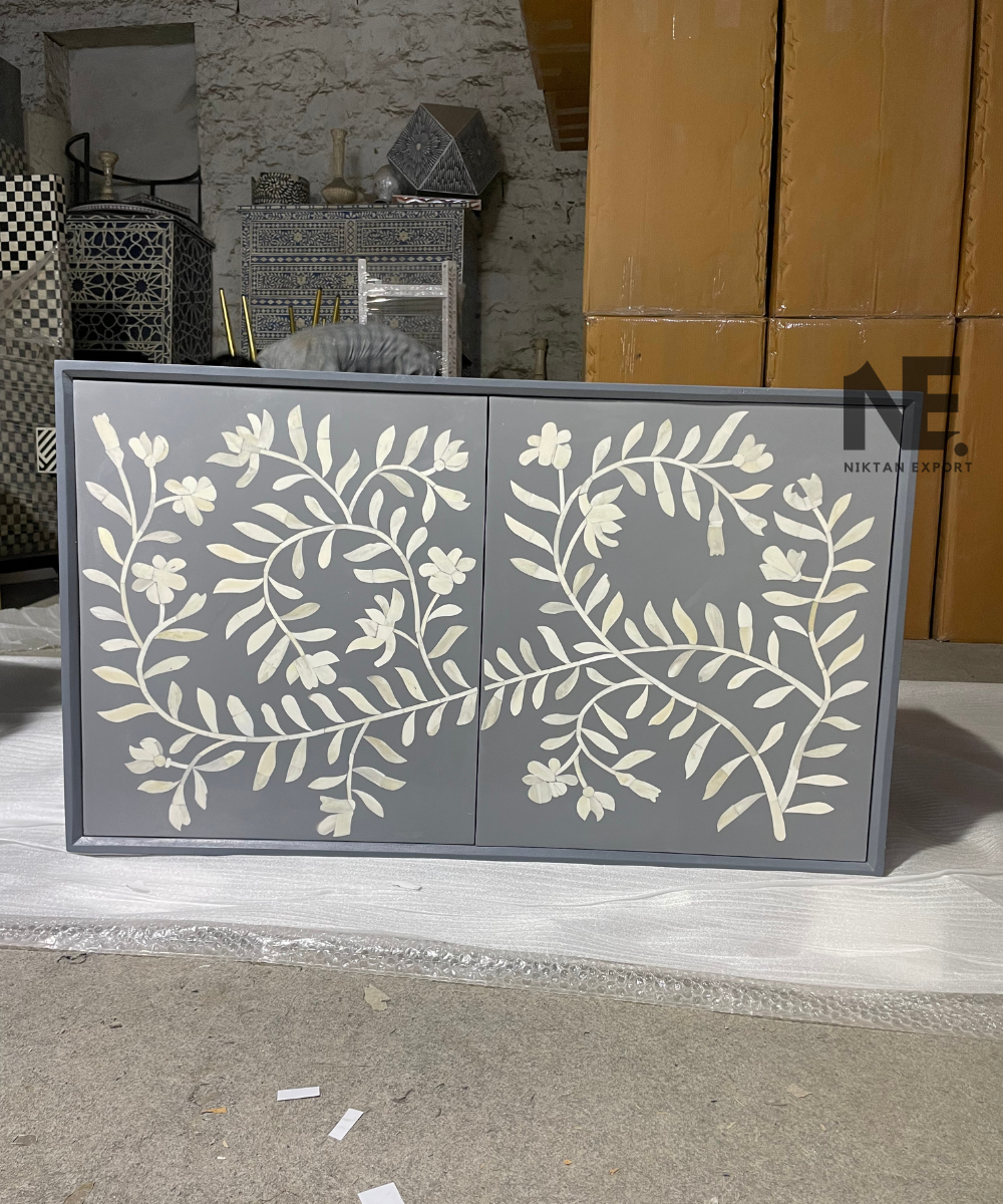 Front view of bone inlay chest of drawers with 2-door cabinet