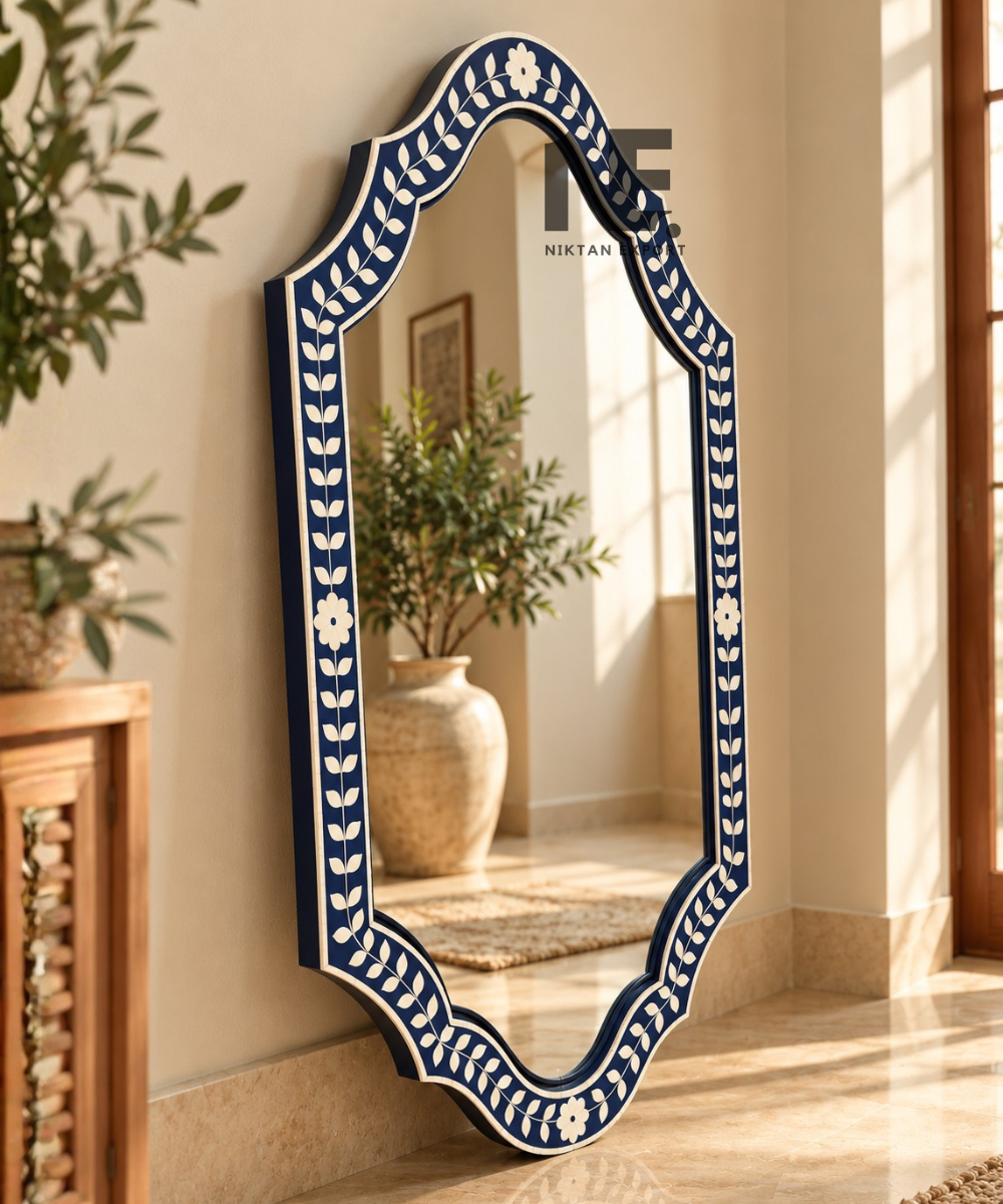 Scalloped navy blue mirror frame with ivory leafy pattern