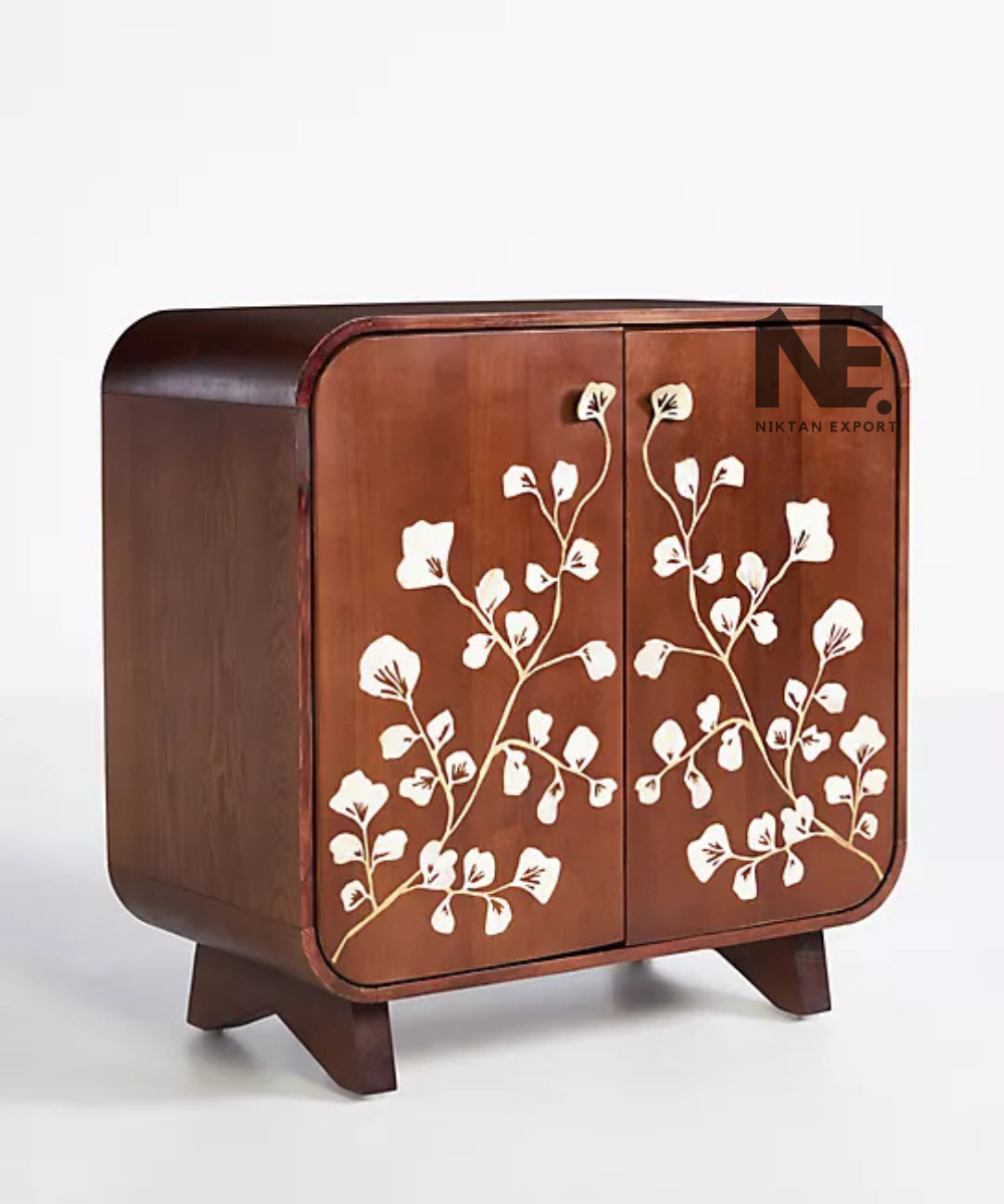 Floral shell inlay design on a brown wooden cabinet