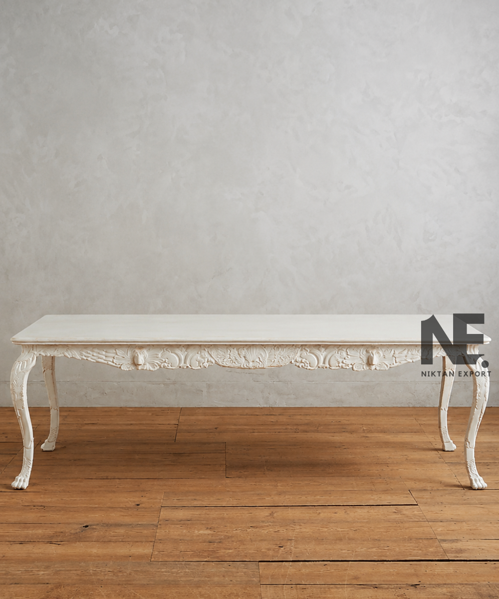 Rectangular wooden dining table with decorative carved apron