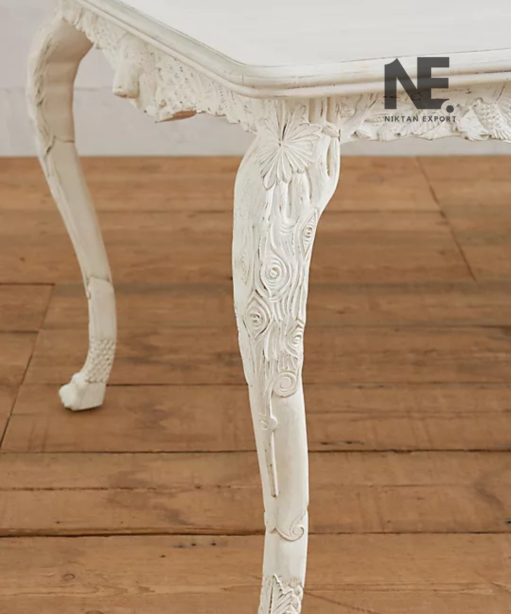 Decorative curved legs of a handcrafted wooden table