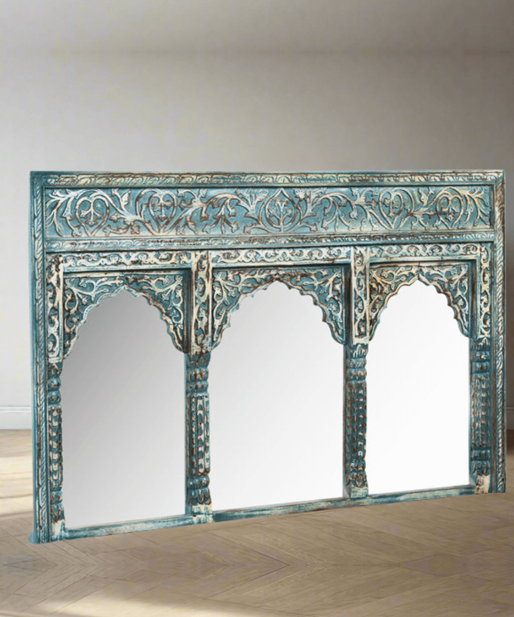 Close-up of hand-carved detailing on distressed frame