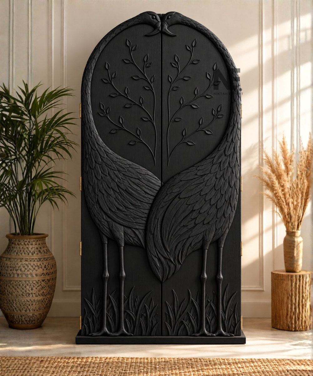 Close-up of carved leaf branches on wardrobe doors