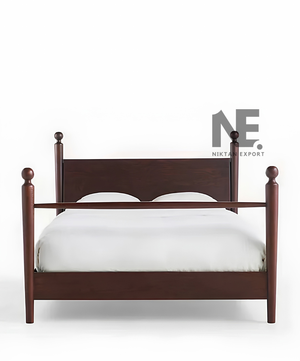 Dark brown wooden poster bed with rounded finials