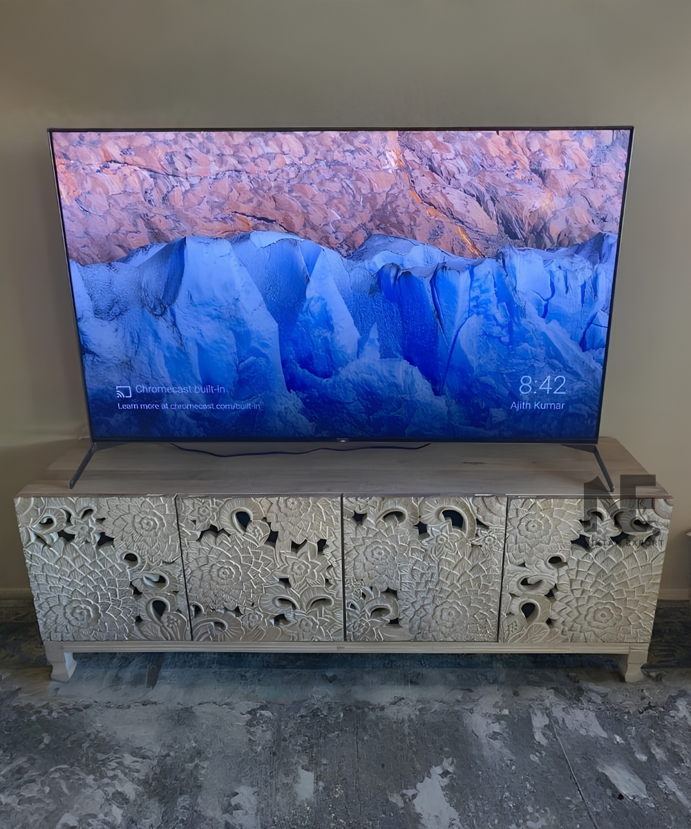 Front view of an ivory carved wooden sideboard