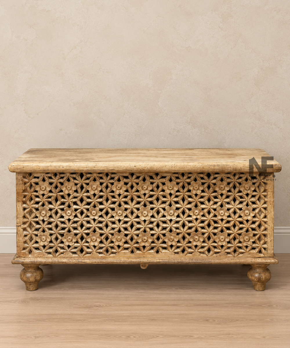 Carved wooden storage trunk in natural wood finish