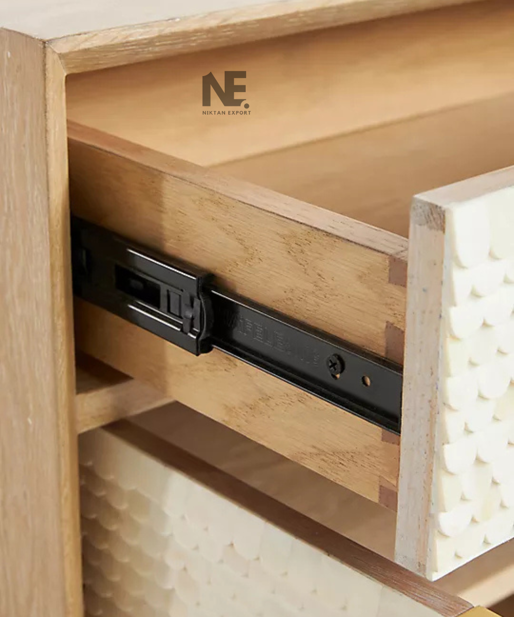 Close-up of scalloped texture on cream cabinet fronts