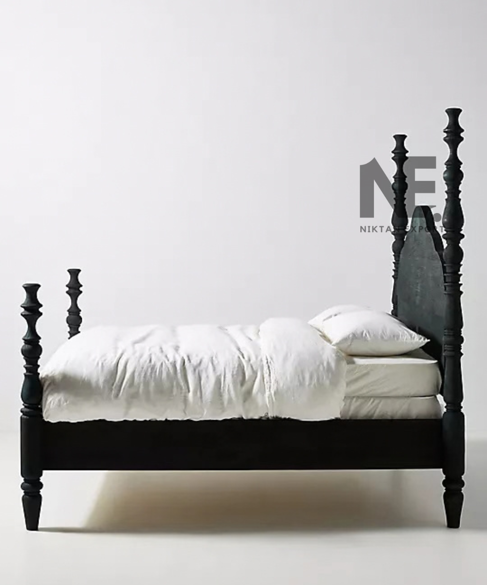 Black wooden footboard and turned bedposts