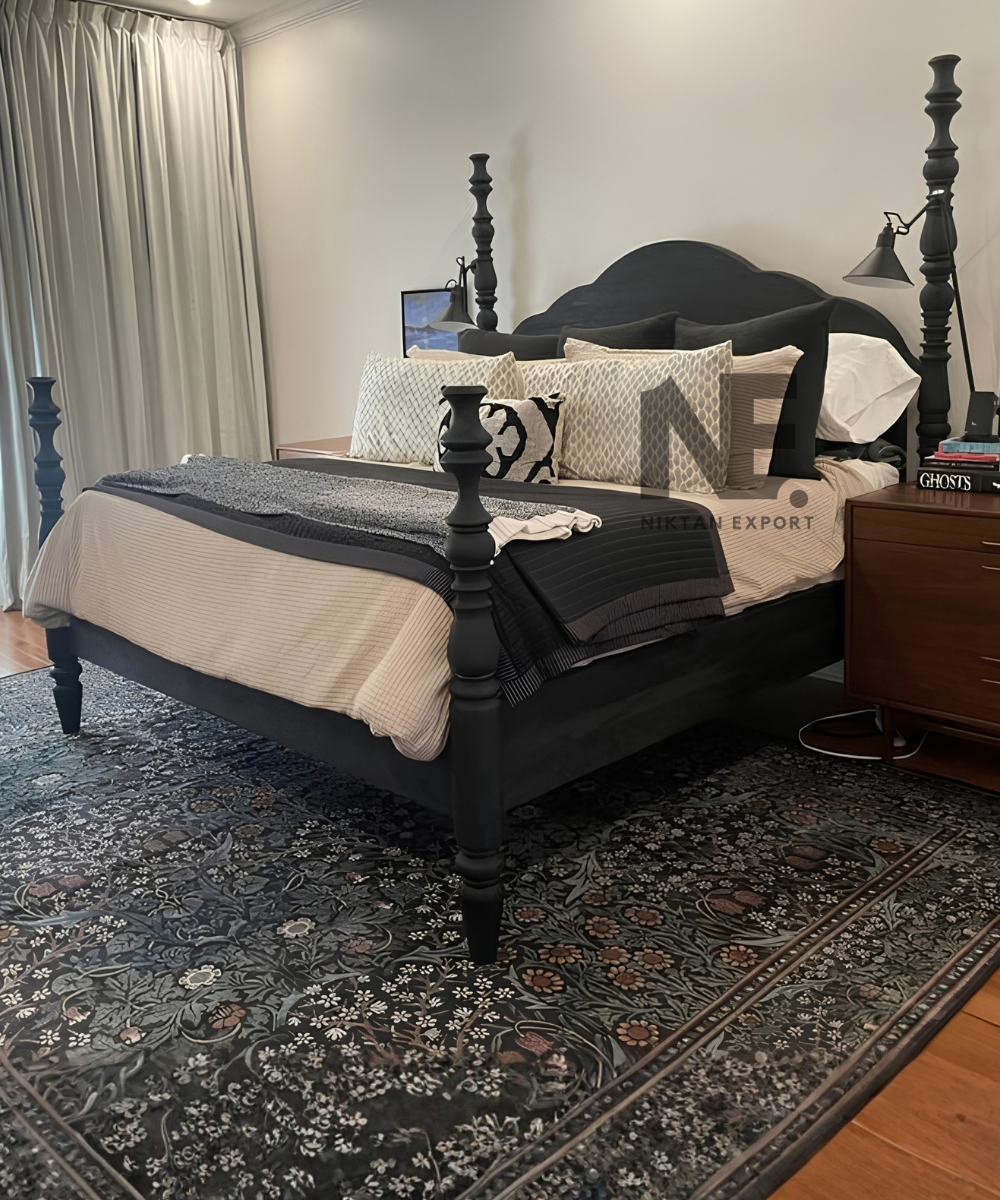 Front view of a black traditional wooden four poster bed