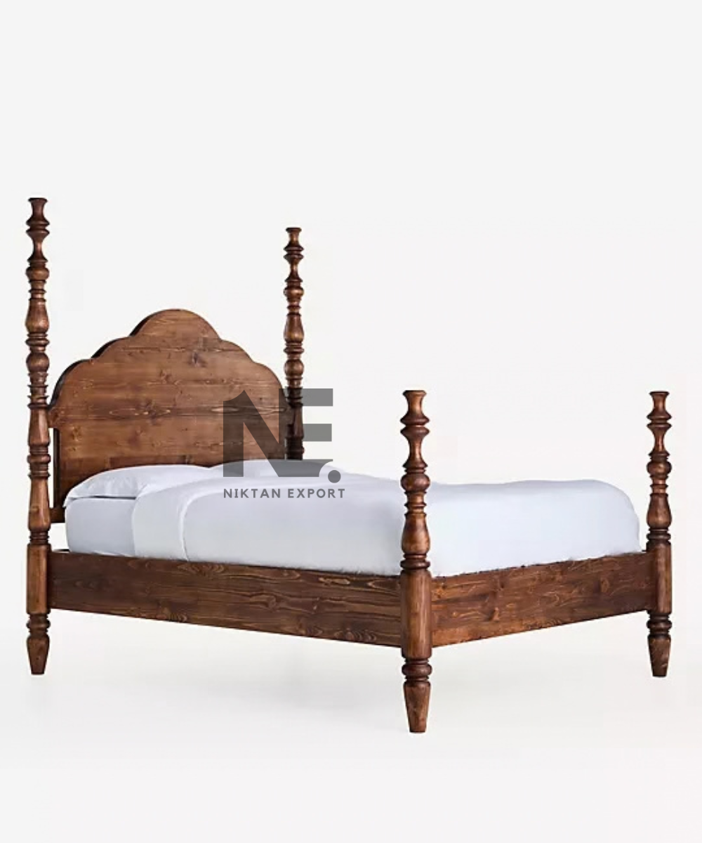 Detail of turned posts on a black wooden bed