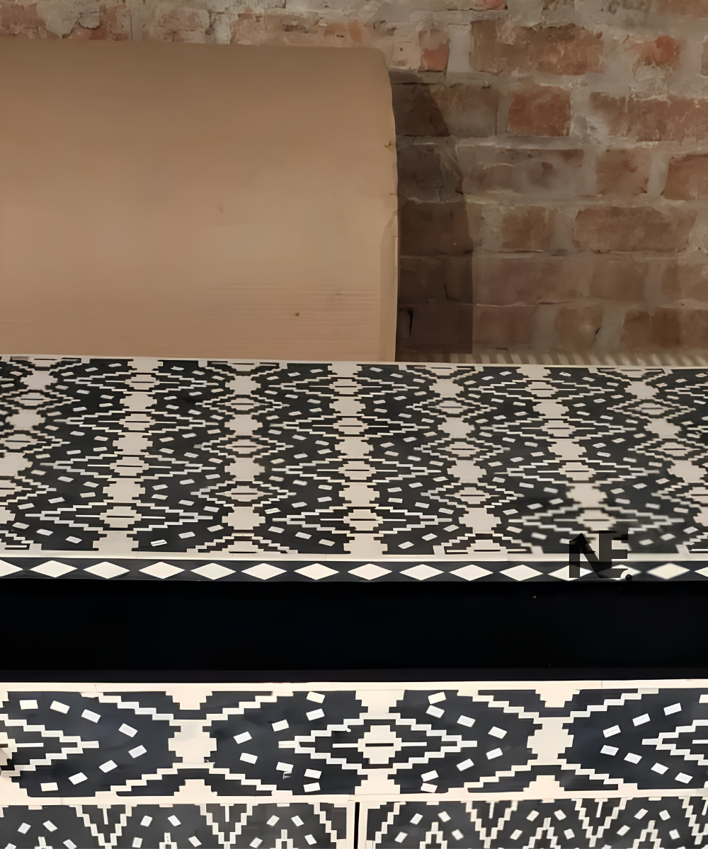 Bone inlay cabinet with brass legs