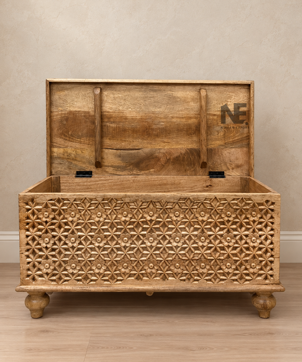 White carved wooden storage trunk with floral lattice front