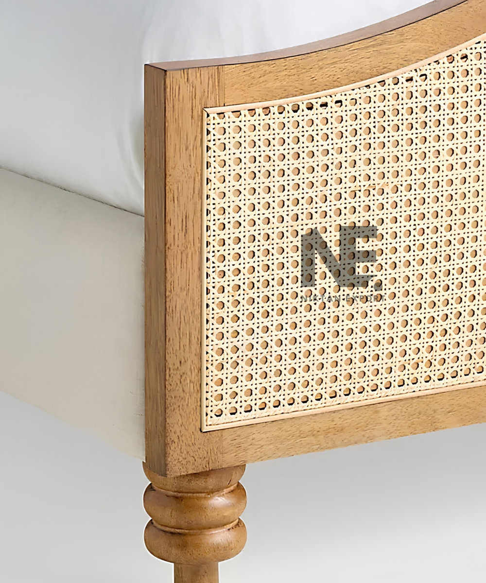Side angle of a wooden bed with woven cane panels