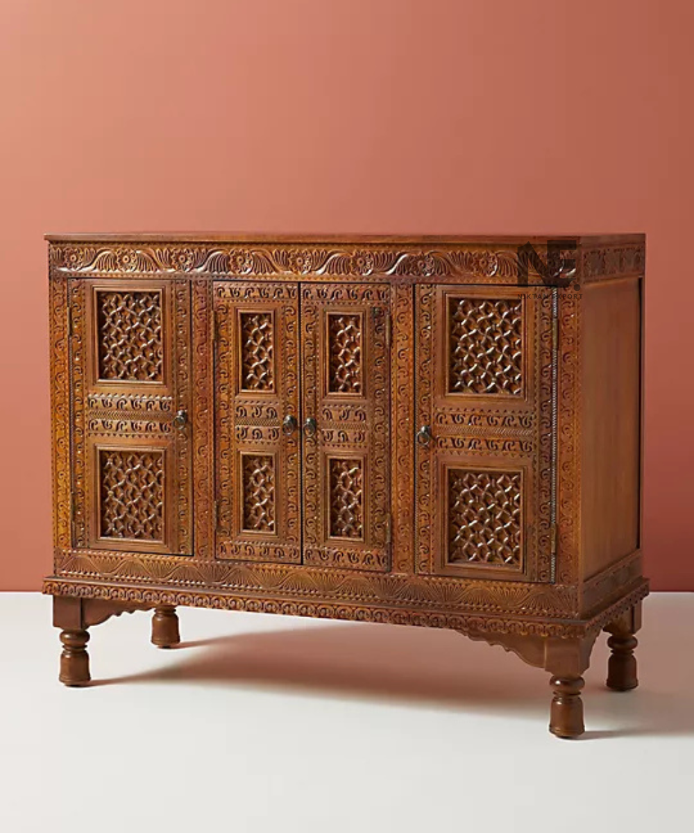 Close-up of detailed carving on dark brown cabinet