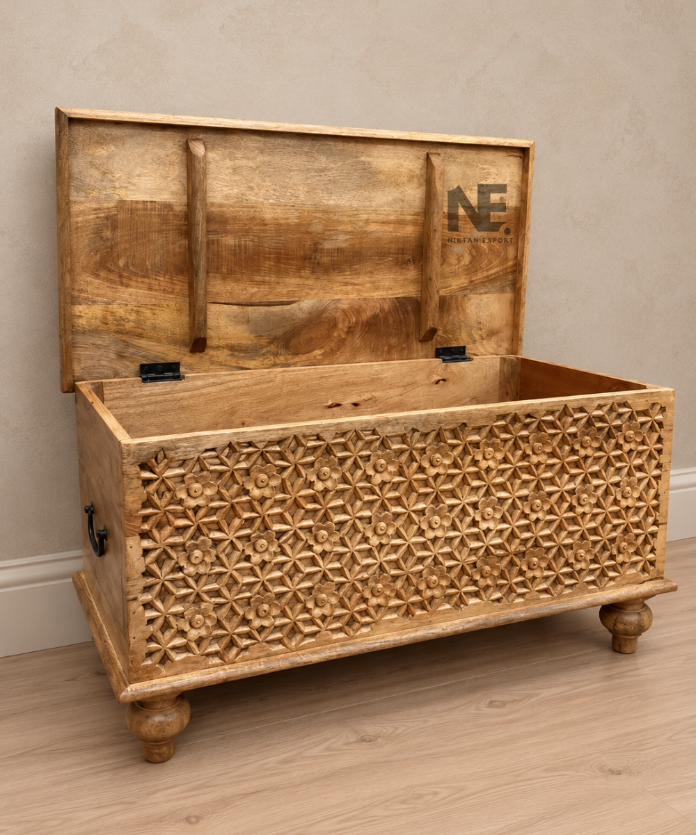 Front view of natural wood storage trunk with geometric carving