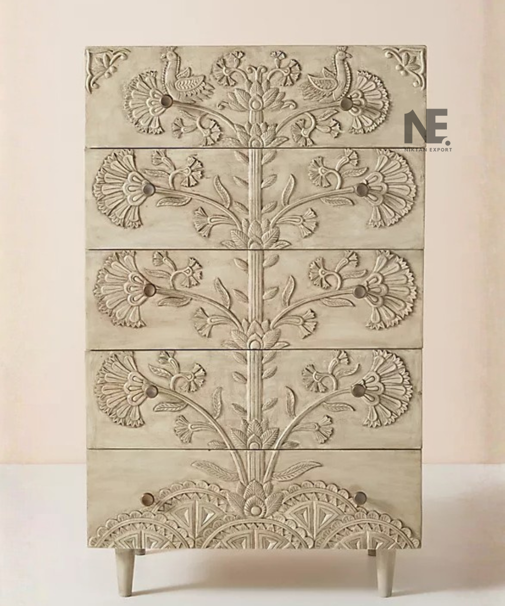 Ivory-beige chest of drawers with ornate decorative carving