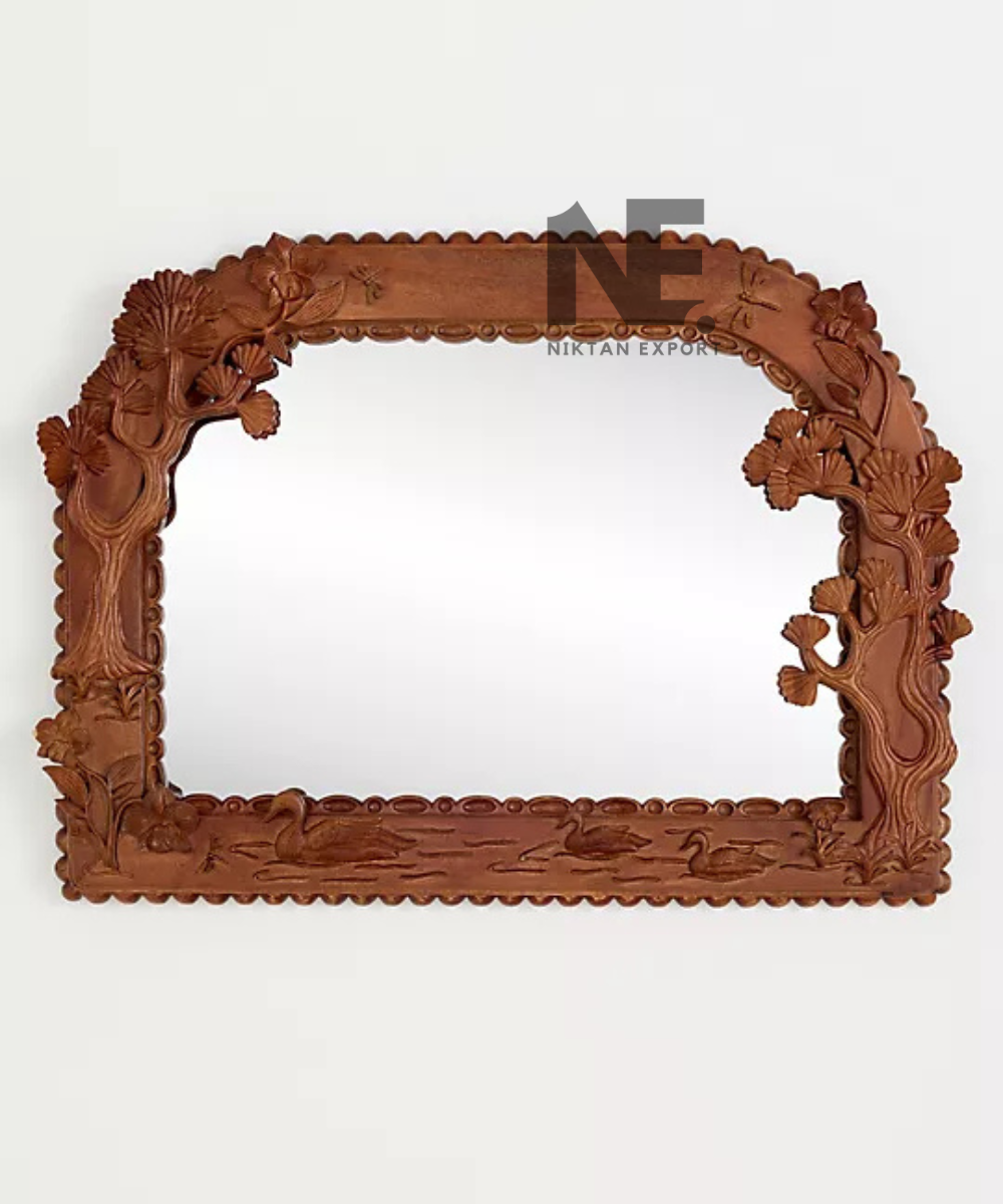 Brown carved mirror frame with leafy branch details