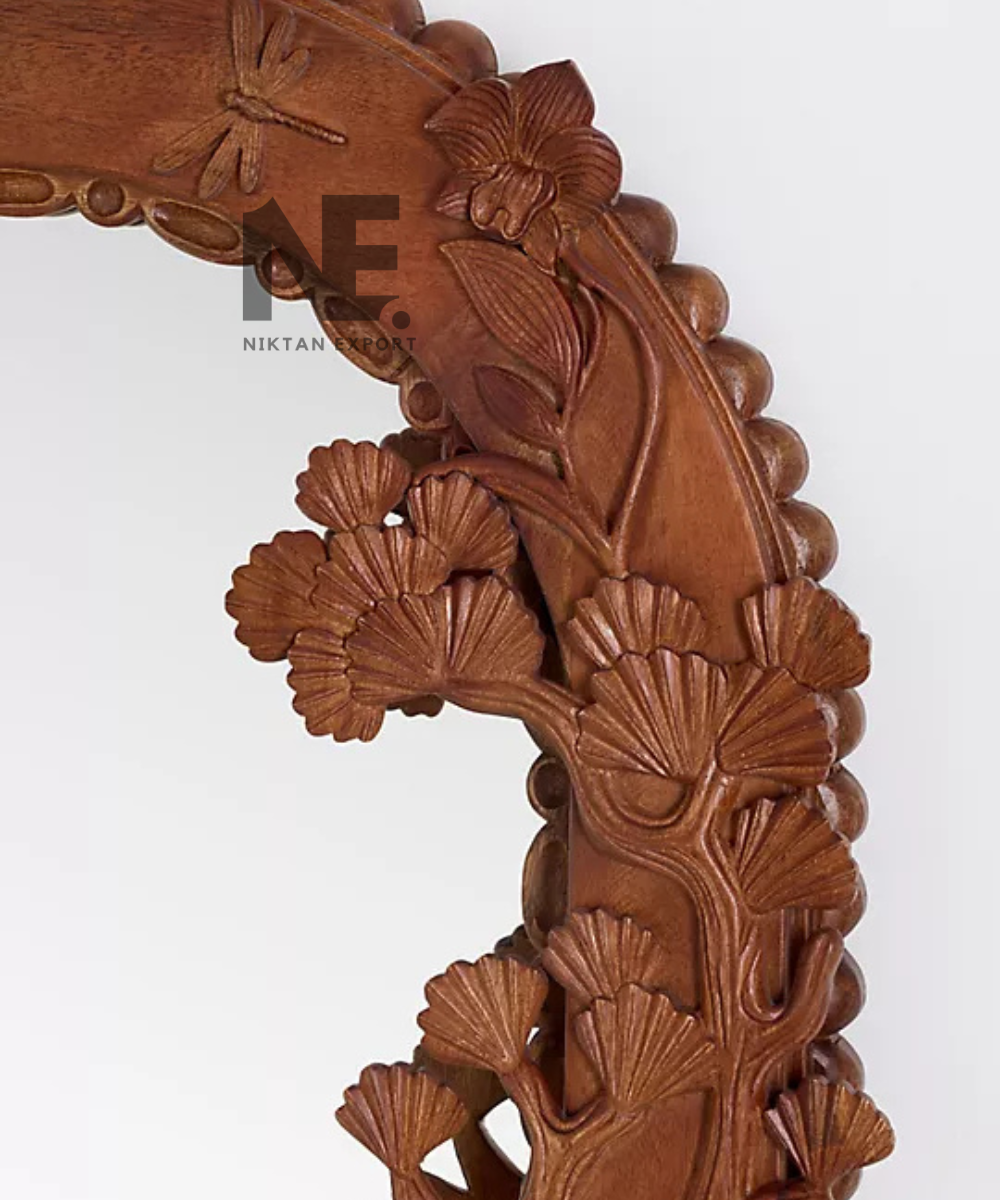Wooden wall mirror featuring carved bird decorations