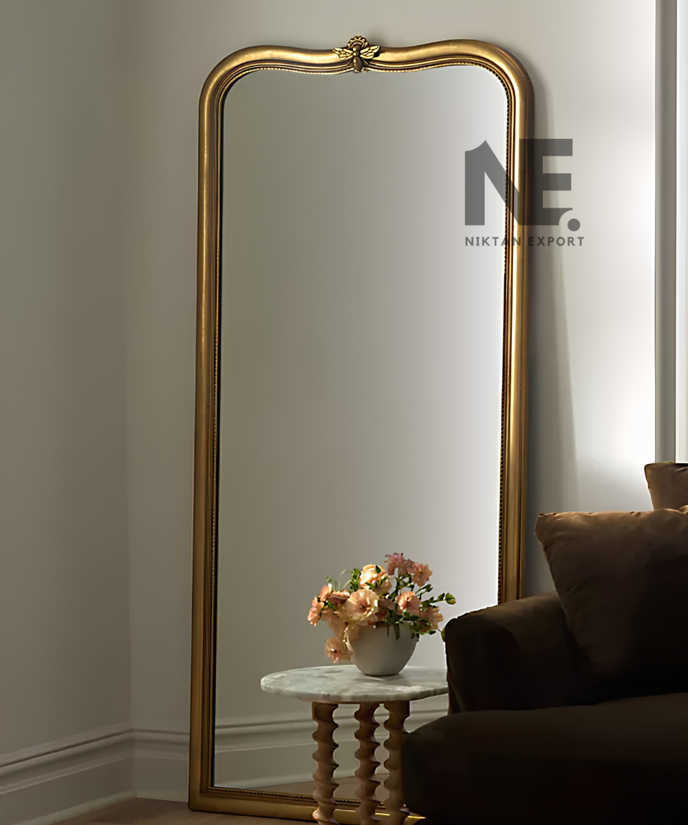 Gold mirror frame with a gently curved top