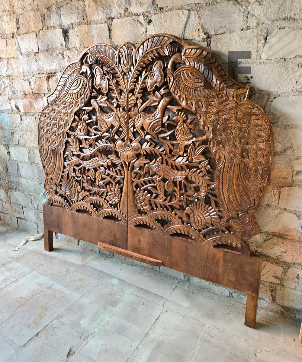 Front view of a decorative carved wooden headboard