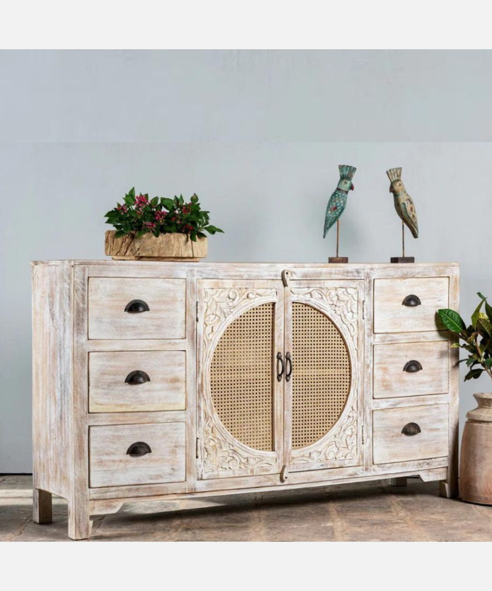 Angled view showing carved wood and drawer design
