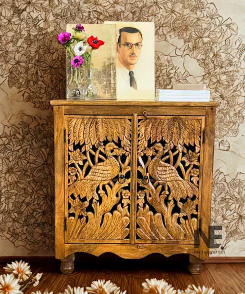 Hand carved wooden sideboard with peacock and floral motifs