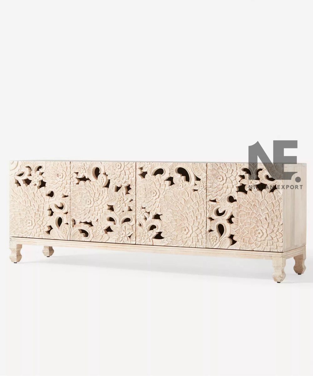 Intricate floral carving across ivory sideboard doors