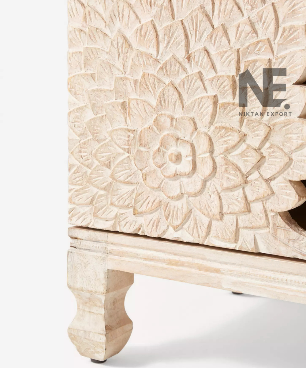 Close-up of detailed floral carving on a wooden sideboard