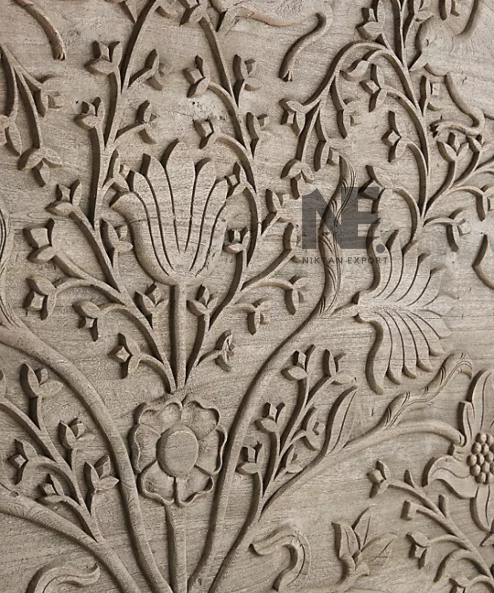 Close-up of floral carving on the bed headboard