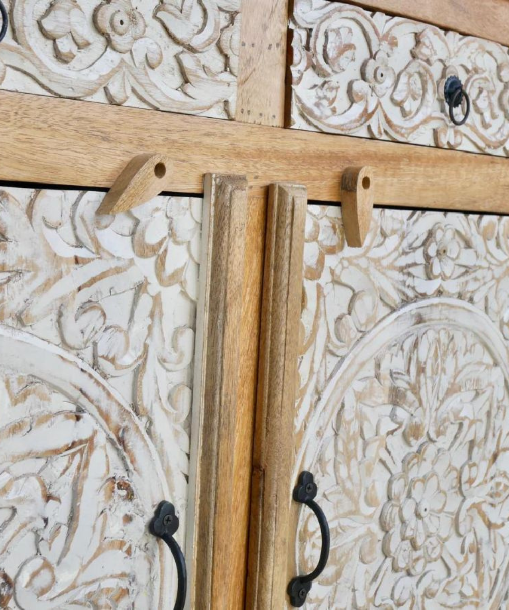 Side profile of floral carved sideboard showing solid wood craftsmanship