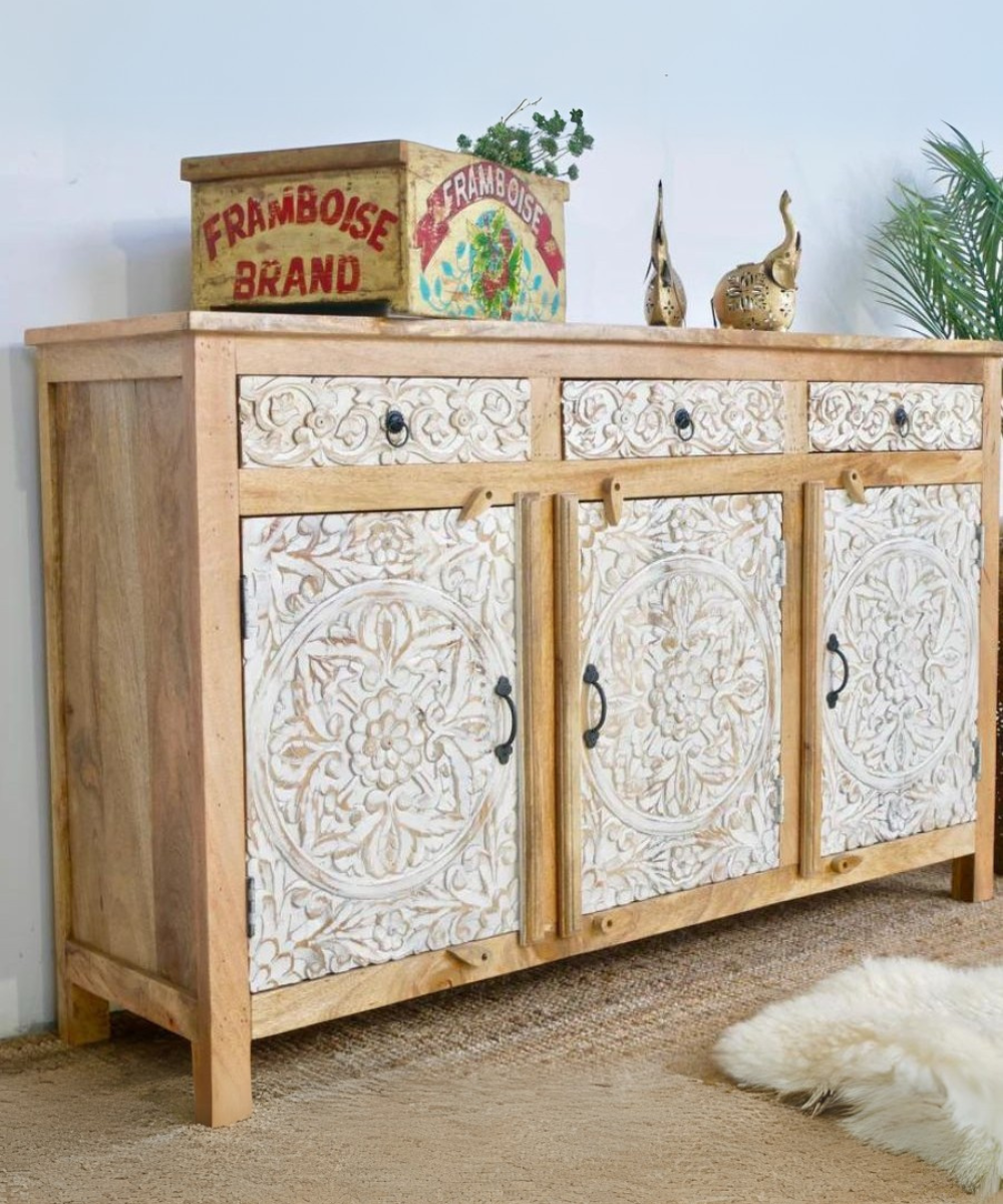 Spacious interior shelves of the wooden sideboard with doors open