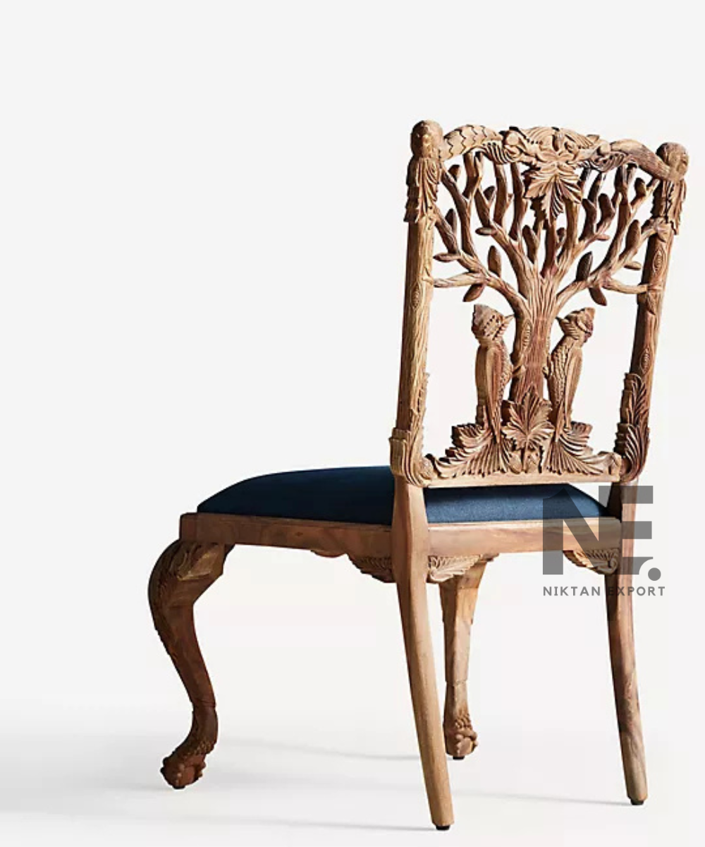 Intricate bird carvings on a wooden chair backrest