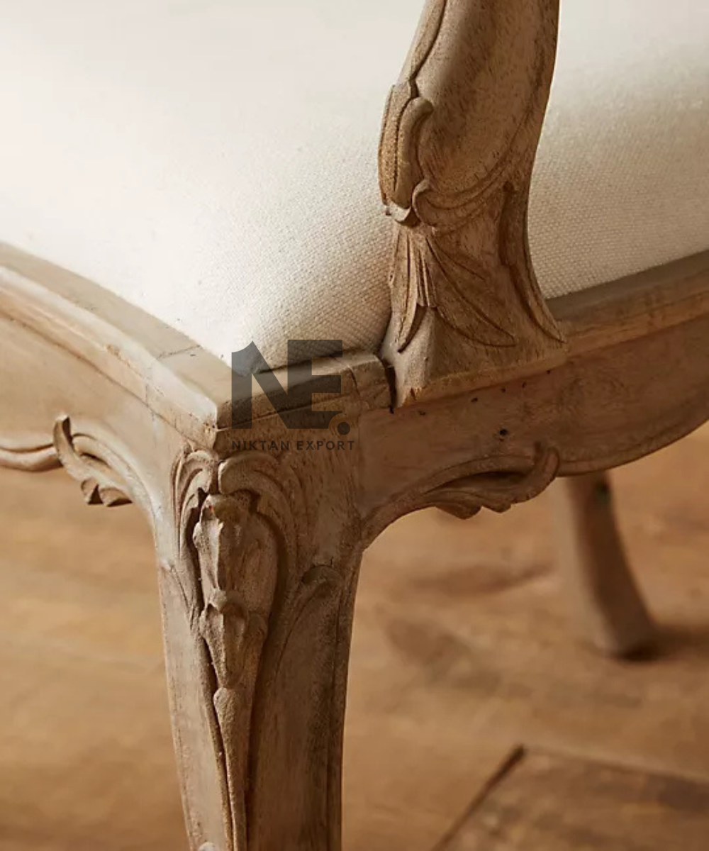 Close-up of carved scrollwork on wooden armchair