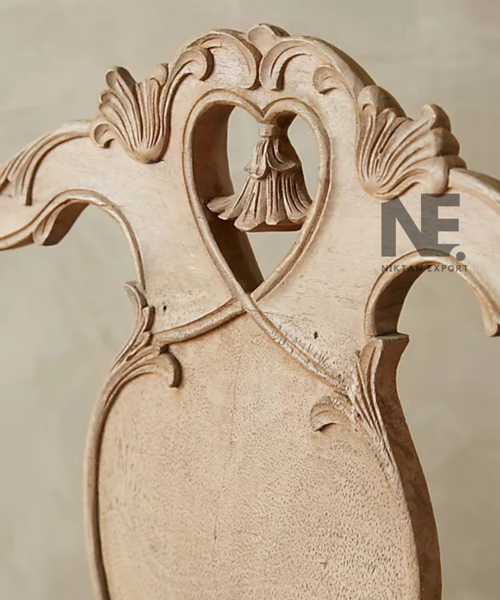 Cream upholstered armchair with decorative wooden frame