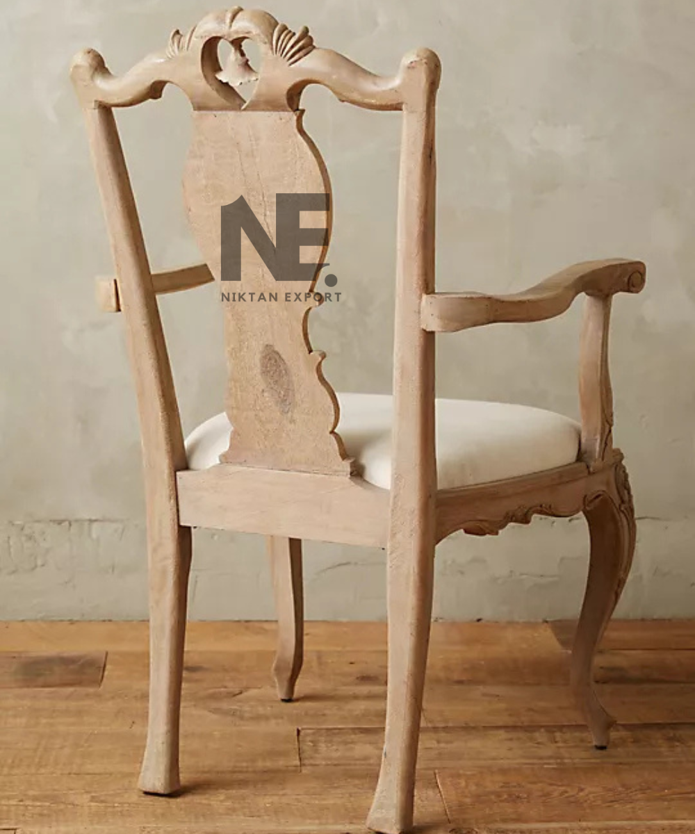 Vintage-style wooden armchair with ornate carved backrest