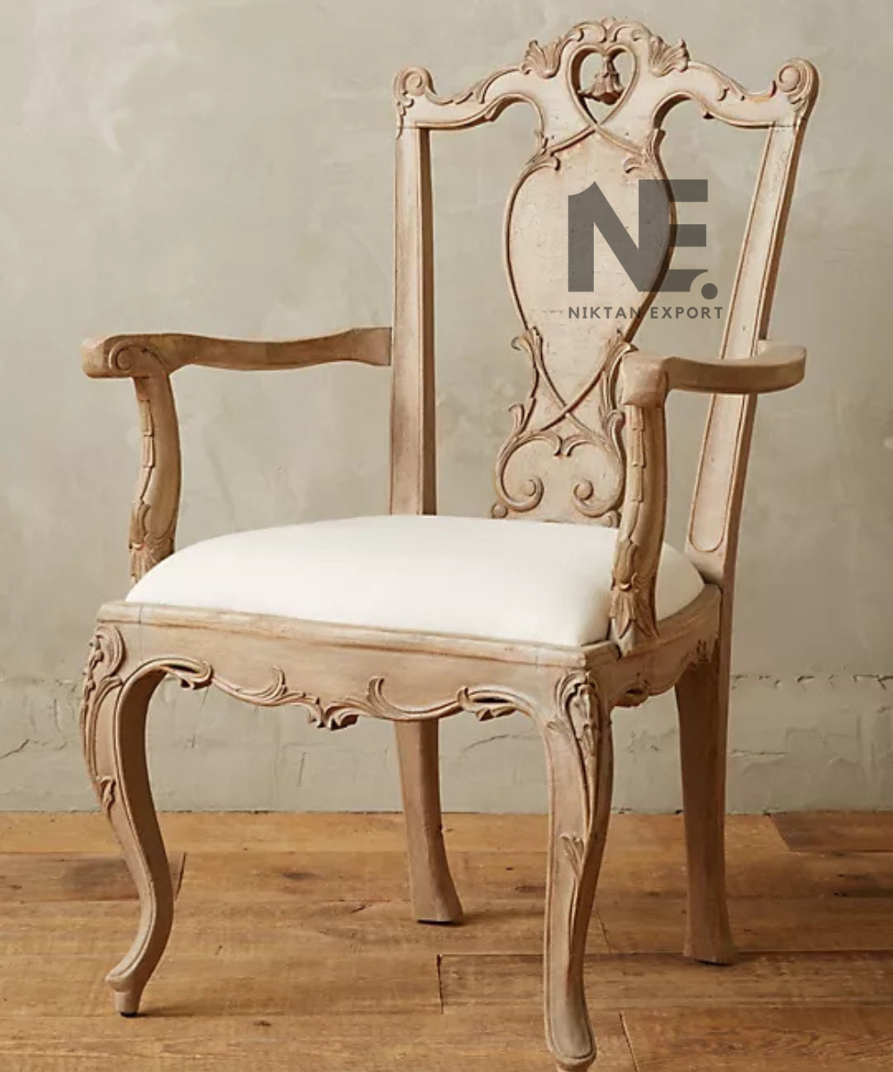 Front view of carved wooden armchair with cream seat
